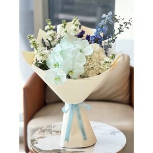 Mint-blue orchid bouquet with white hydrangeas and blue delphinium, White Blossoms flower boutique Dubai Abu Dhabi