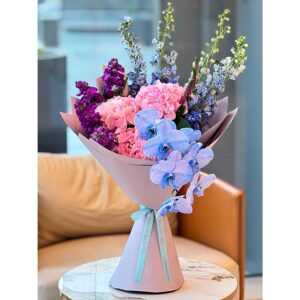 Violet Skies Bouquet with blue orchids, pink hydrangeas, and purple stock flowers, White Blossoms flower boutique Dubai Abu Dhabi