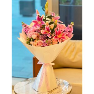 Stargazer Charm Bouquet with pink stargazer lilies and peach roses, White Blossoms flower boutique Dubai Abu Dhabi